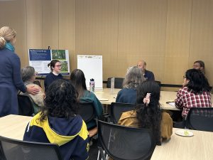 Photo of 10 attendees at the U-M Resilient Grounds town hall around a table