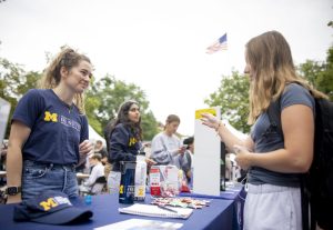 Two students talk at Earthfest