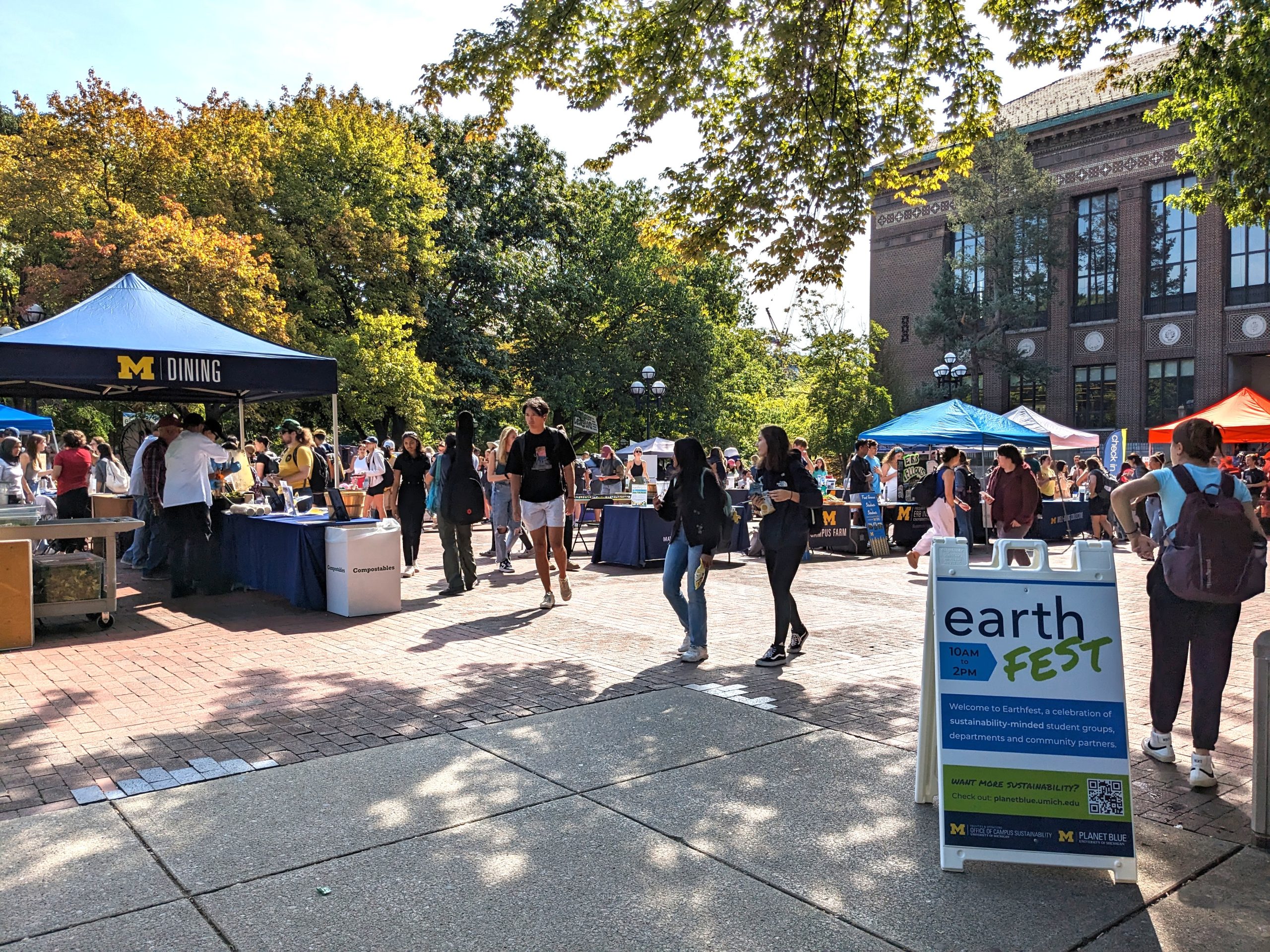People walk around the Diag during Earthfest, a large tabling event.